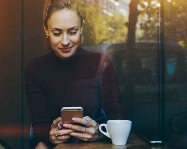 Woman holding cell phone