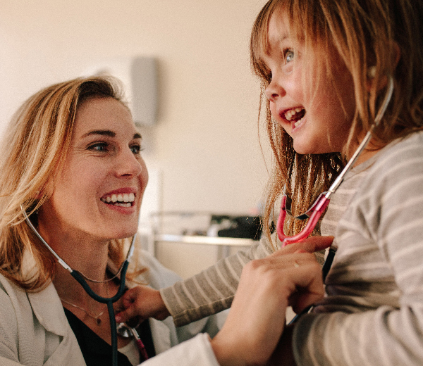 Doctor listening to patient's heart